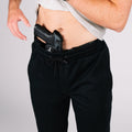 Gray Carrier Sweatpants Mk.II displayed with a black belt, designed as concealed carry sweatpants for maximum support.