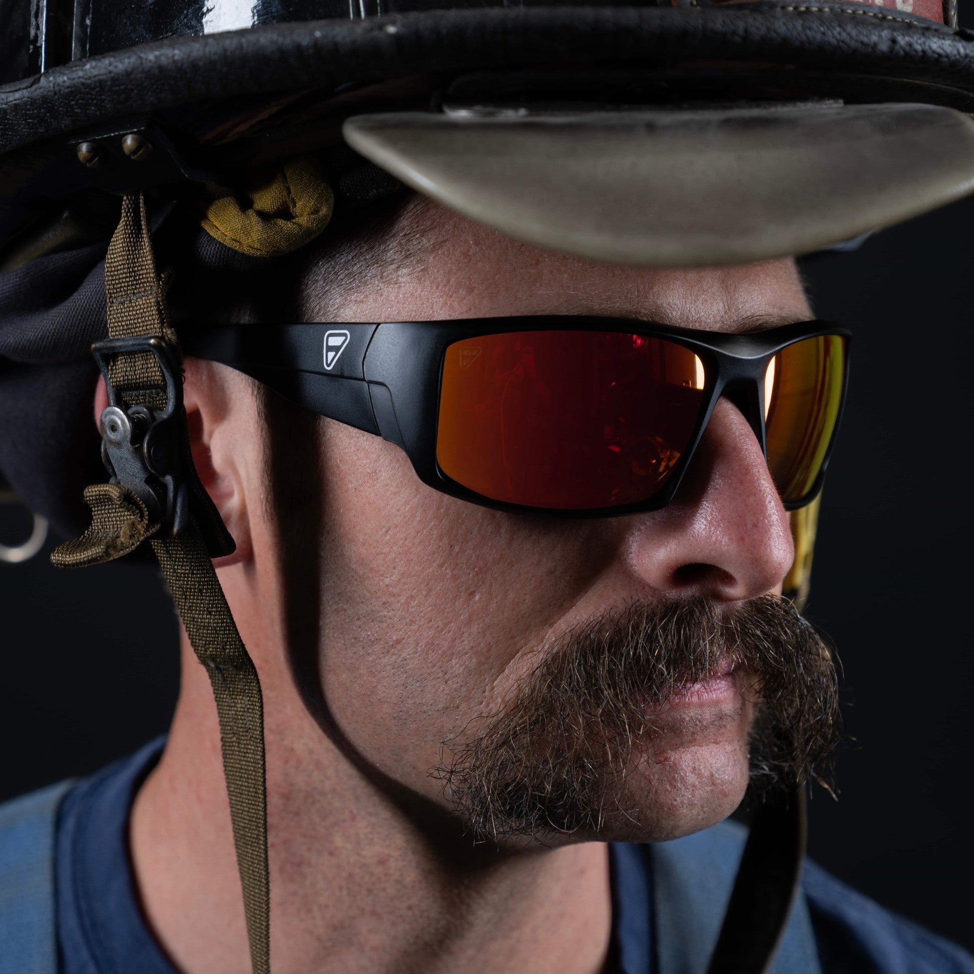 Close-up of Ten-8 Crimson sunglasses showcasing the shiny crimson red polarized lenses.