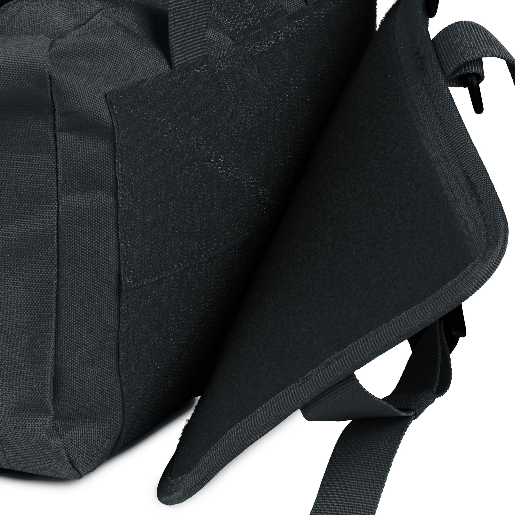Compact Scherber Vehicle IFAK Emergency Trauma Kit pouch attached to a car headrest, designed for fast and easy access during emergencies.