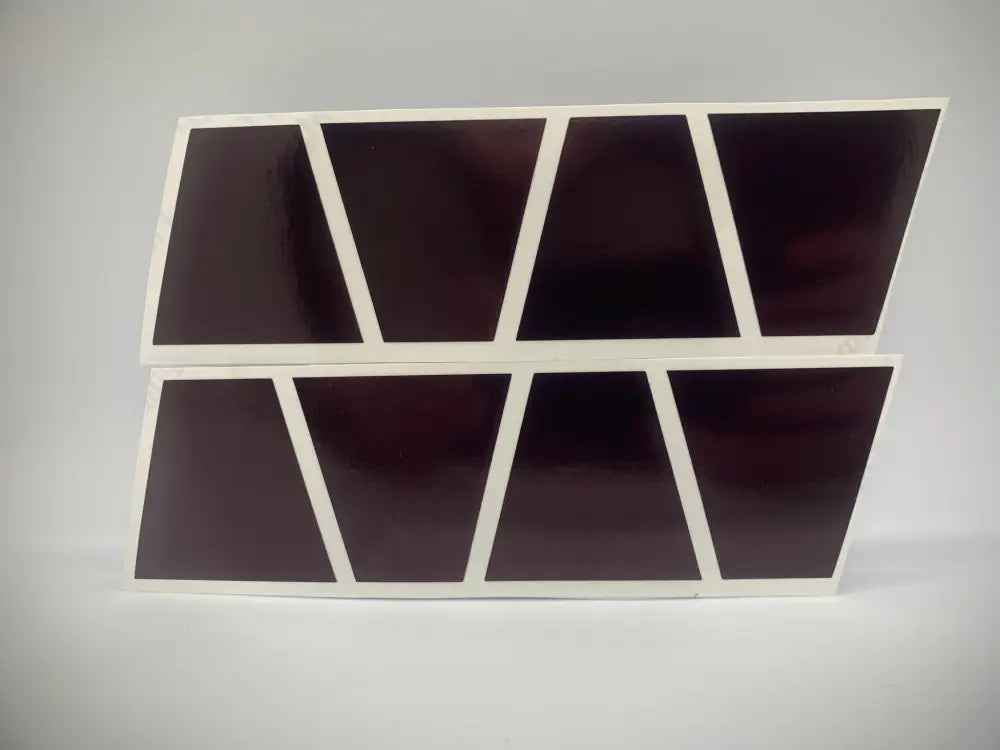 Abstract geometric wall shelf with pink reflective helmet compartments and white borders