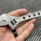 Adjustable Wrench - Titanium 6 Inch with circular holes drilled into the handle