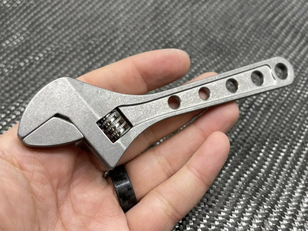 Adjustable Wrench - Titanium 6 Inch with circular holes drilled into the handle