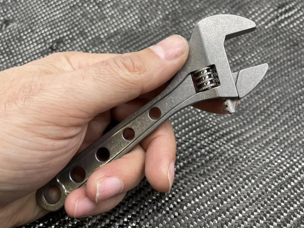 Adjustable Wrench in hand, showcasing the NSN Pending Titanium 6 Inch Wrench