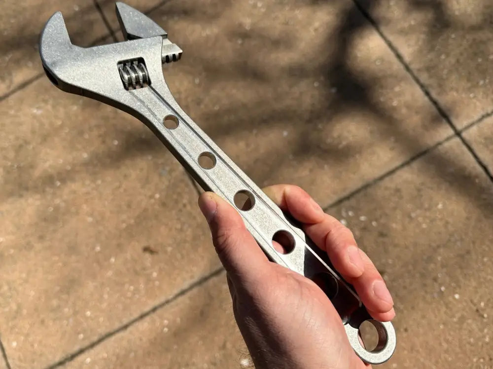 Person holding a 12 Inch Lightweight Corrosion Resistant Titanium Adjustable Wrench