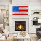 American flag artwork with red silver blue design above a white brick fireplace