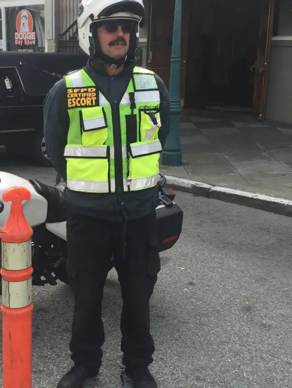 Security guard in ANSI II Cert High Visibility Vest made of fluorescent green mesh