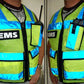 High visibility radio vest featuring reflective stripes and radio pouches for safety