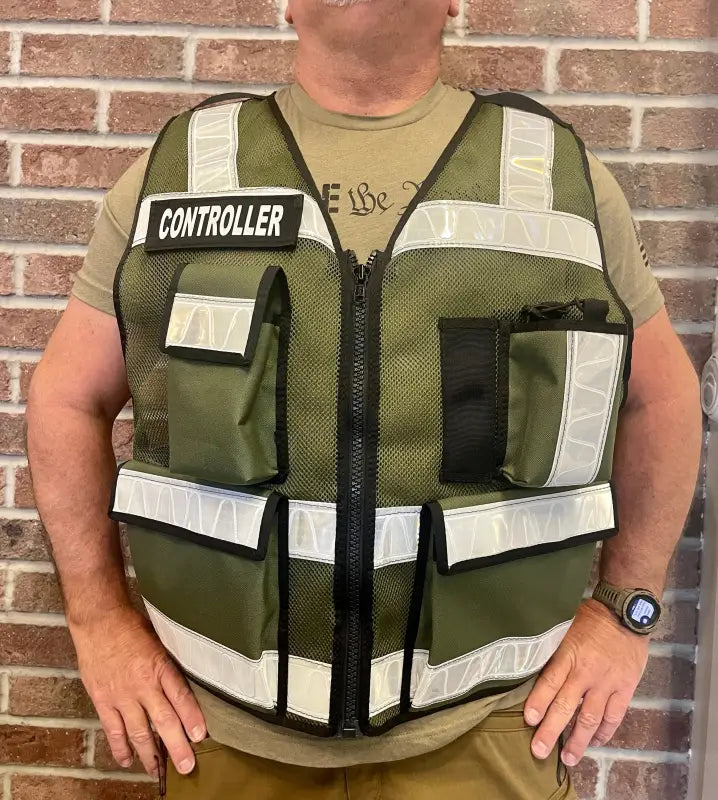 Olive green ODOT Incident Command Vest with reflective stripes over tan shirt