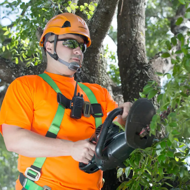 Arborist using a hedge trimmer wearing a Rescue Hard Hat with ratchet suspension