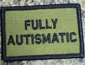 Military-style olive drab patch with black border and text Fully Autismatic 2x3 Patch