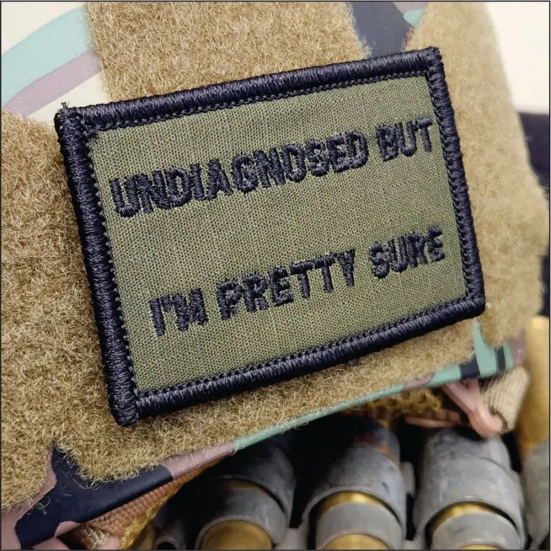 Military morale patch reading UNDIAGNOSED BUT IM PRETTY SURE in olive drab w black