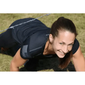 Athlete in black fitted performance shirt smiling during plank exercise