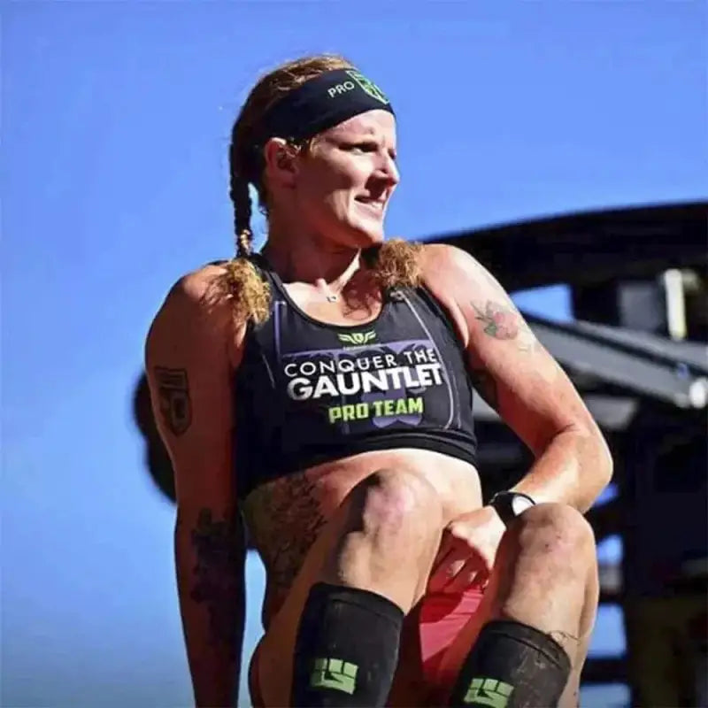 Athlete in Conquer the Gauntlet gear showcasing tall compression socks for long distance courses