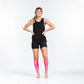 Athletic figure in black workout attire showcasing Neon Pink Compression Sleeves