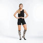 Athletic figure in black workout attire and knee-high socks featuring Marathon Leopard design