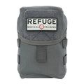 Grey medical training pouch with REFUGE branding and MOLLE attachments on BearFAK 3.0 kit