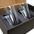 Two etched airplane axe glasses in foam packaging from BenShot Fire Axe Glasses