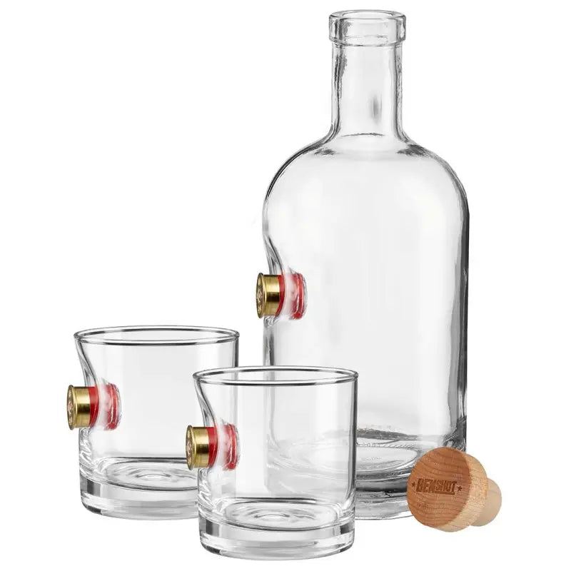 Clear glass bottle with wooden cork and two BenShot Shotgun Shell glasses