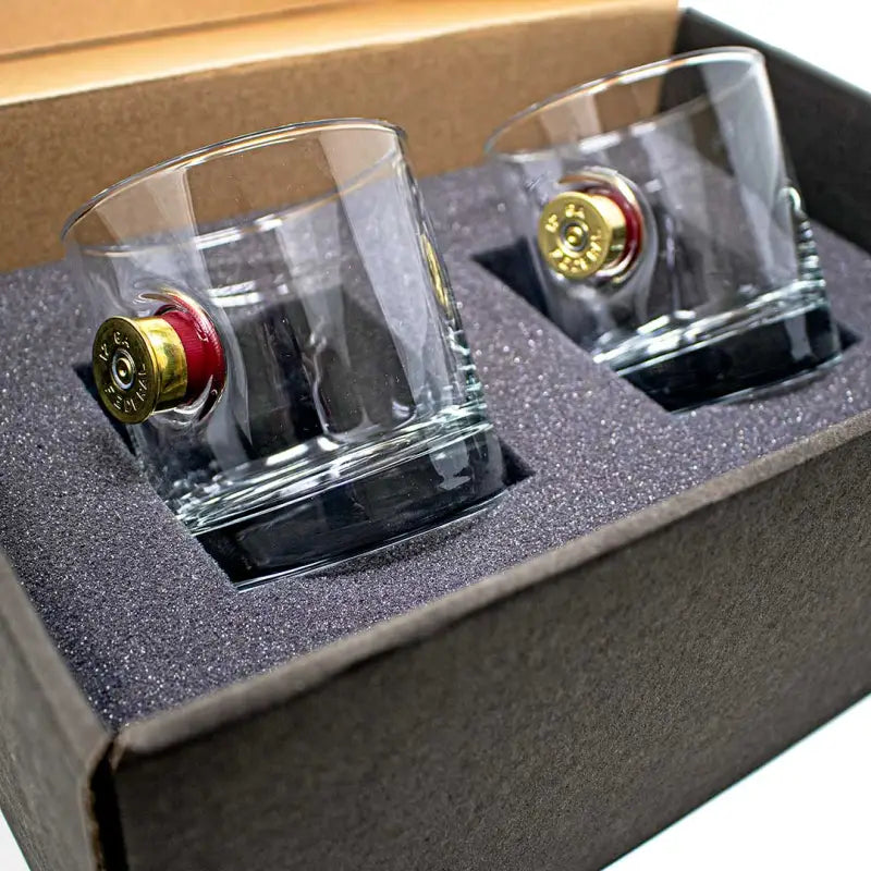 Two BenShot Shotgun Shell Glasses with bullet casings embedded in the bases