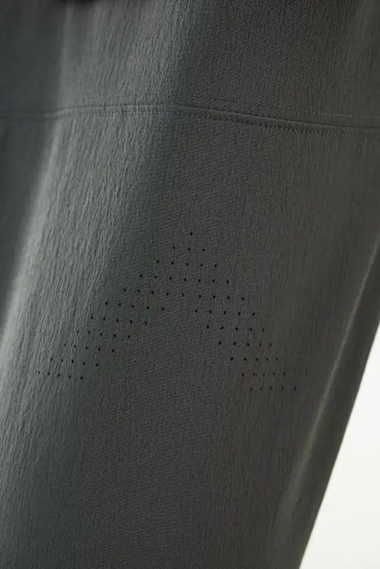 Black athletic Carrier Traveler Joggers with perforated design and concealed carry feature