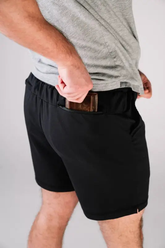 Black athletic shorts with wallet, perfect for concealed carry by Arrowhead Tactical Apparel