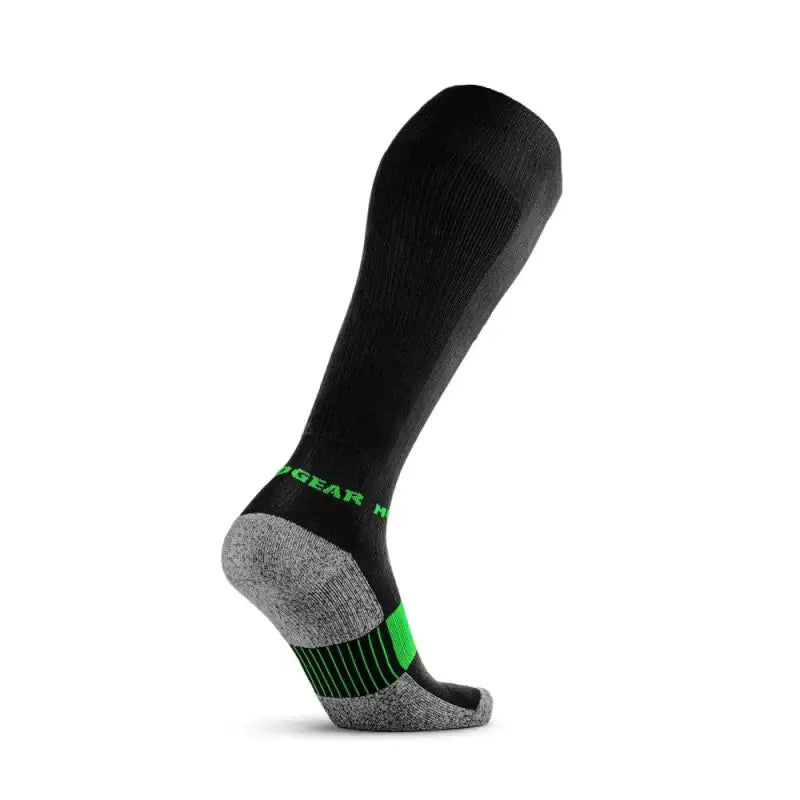 Black tall compression socks with neon green accents and gray cushioned sole