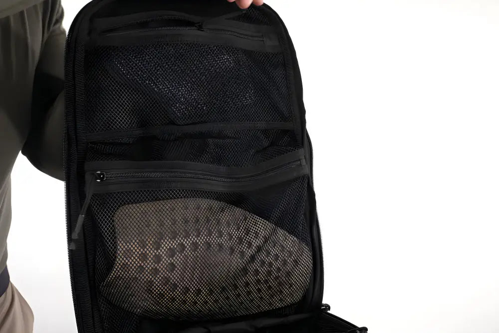 Black backpack with mesh side pocket, perfect as a discreet rifle backpack