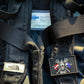 Black backpack with patches and Solas tape slap strap, perfect for first responders