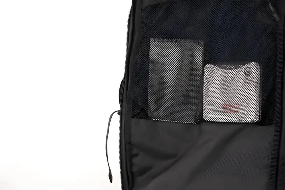 Black backpack pocket with mesh compartments in SUMMIT Discreet Rifle Backpack design