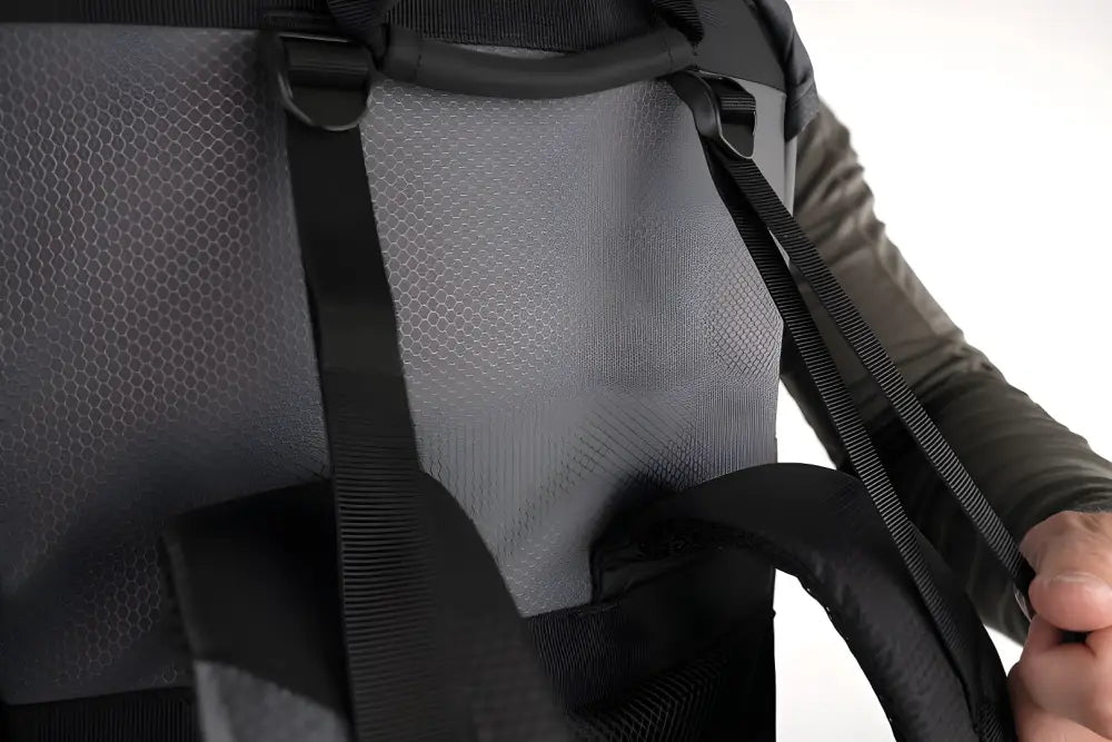 Black backpack strap with textured fabric and adjustable buckle on SUMMIT Discreet Rifle Backpack