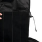 Black backpack with vertical stripes, featuring zipper details, ideal discreet rifle backpack