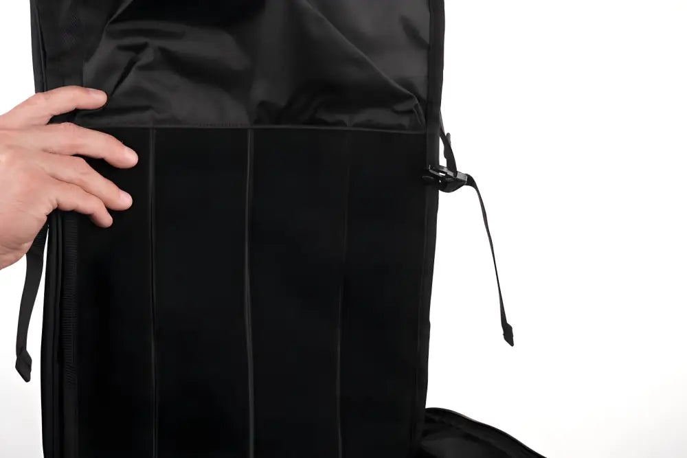 Black backpack with vertical stripes, featuring zipper details, ideal discreet rifle backpack