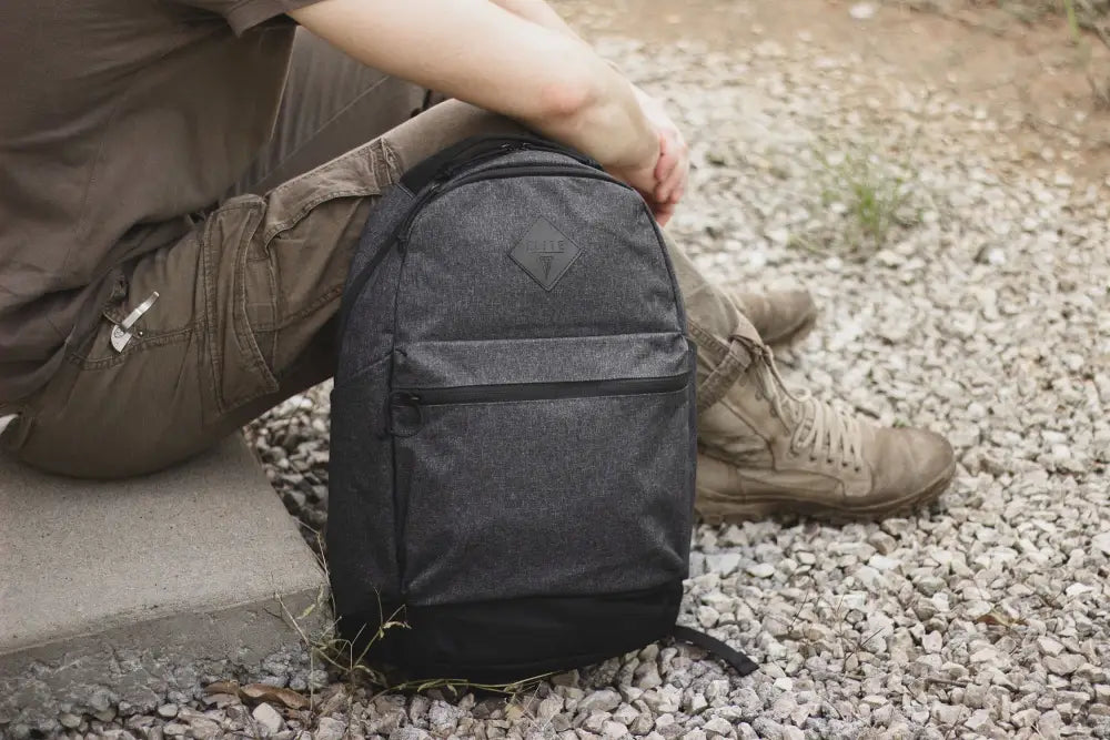 Black ECHO EDC Backpack with front zippered pocket, ideal for concealed carry