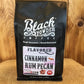 Black bag of Cinnamon Rum Pecan Flavored Coffee for rich cinnamon rum pecan taste