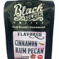 Black bag of Cinnamon Rum Pecan flavored coffee with medium roast indicator