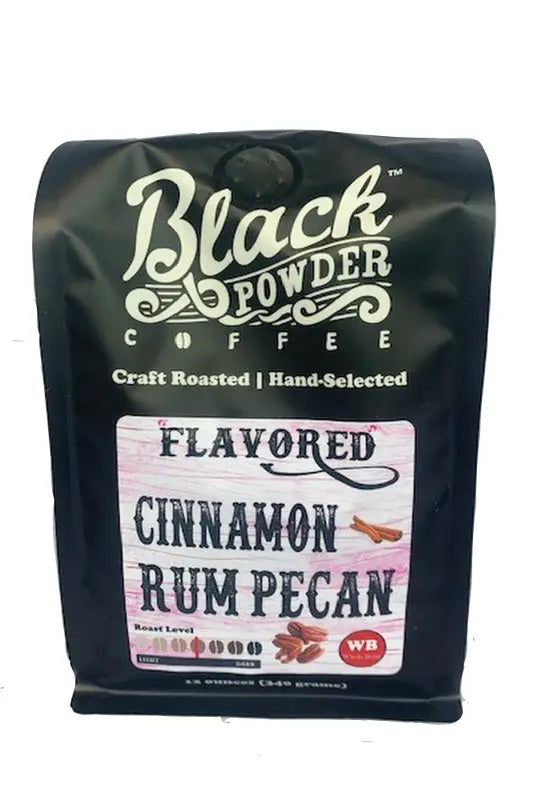 Black bag of Cinnamon Rum Pecan flavored coffee with medium roast indicator