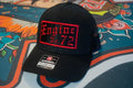 Black Richardson 112 trucker snapback cap with Old English Passport and polyester mesh back