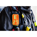 Black bottle with orange E29 label on IdentiFire SCBA Accountability Shoulder Strap System
