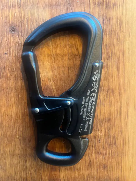 Black climbing carabiner with auto-locking gate for firefighters, police, and first responders