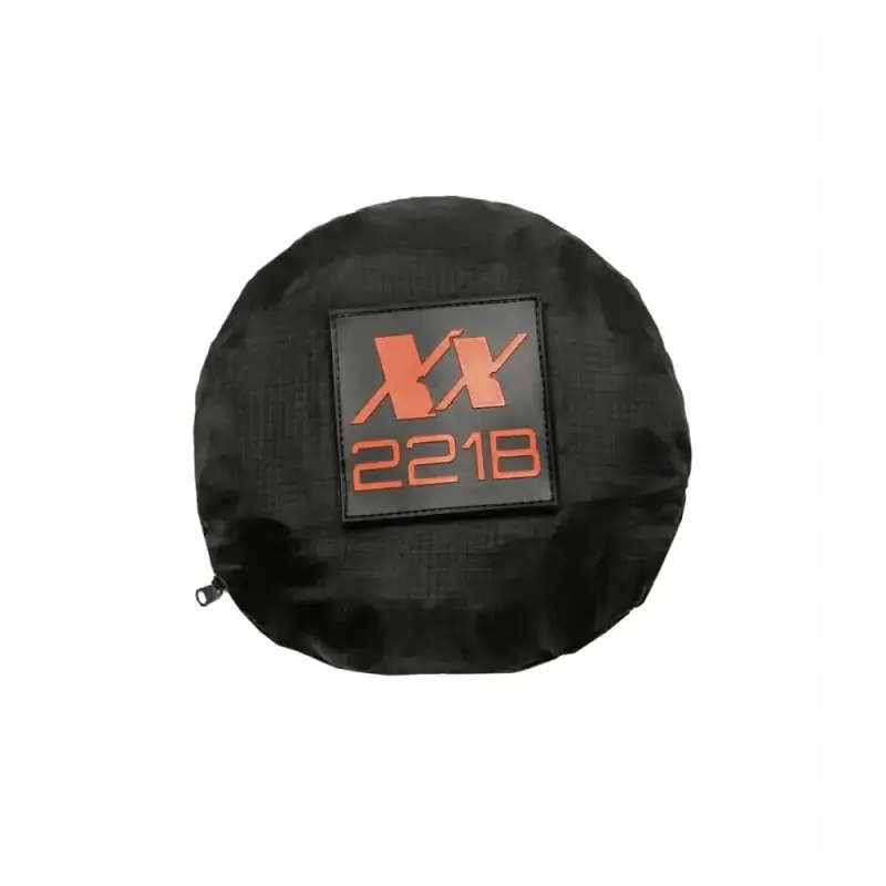 Black circular storage bag with orange XX 221B logo for Venture Packable Daypack