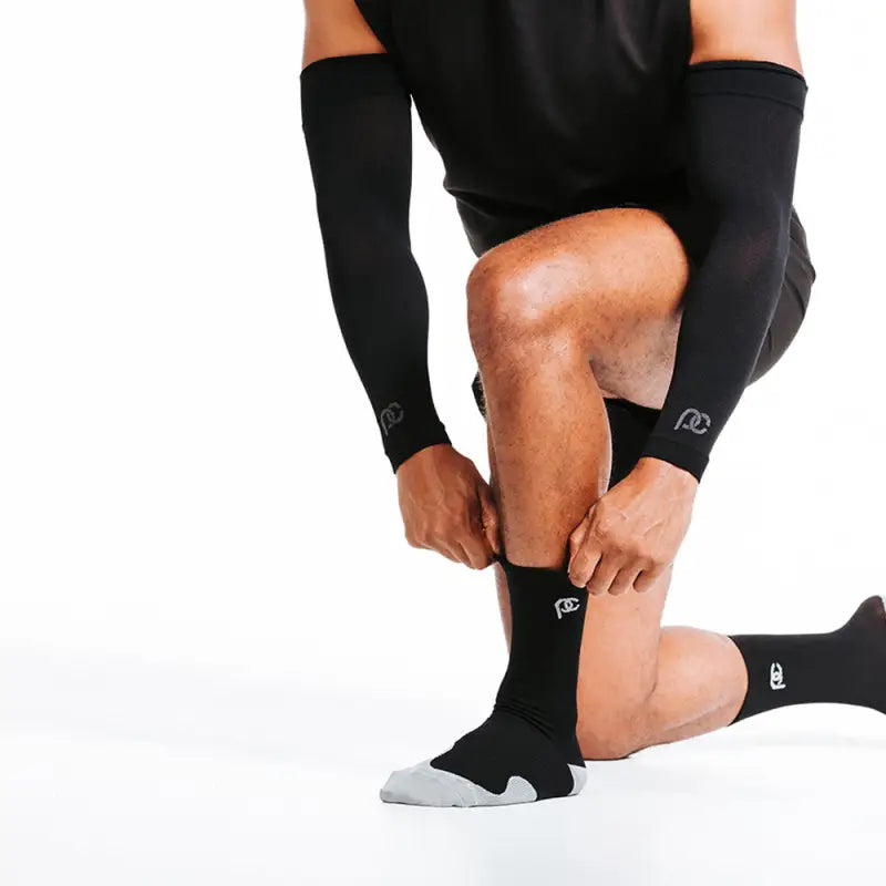 Black compression socks with gray heel and toe, ideal for arm sleeves support