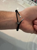 Black cord bracelet with silver metal accents, The Breaklet - Emergency Escape Bracelet