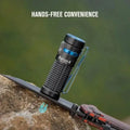 Black Olight Baton4KitBK flashlight with textured grip and pocket clip for EDC use