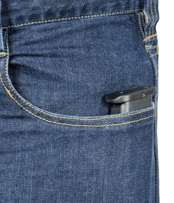 Black electronic device in blue denim pocket of Asset Tactical Jeans for convenience