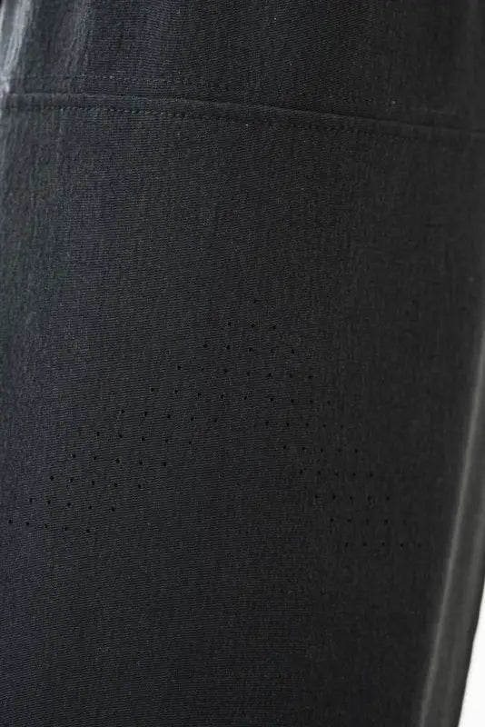 Black fabric with perforations for Carrier Traveler Joggers - Midnight Black, ideal for concealed carry