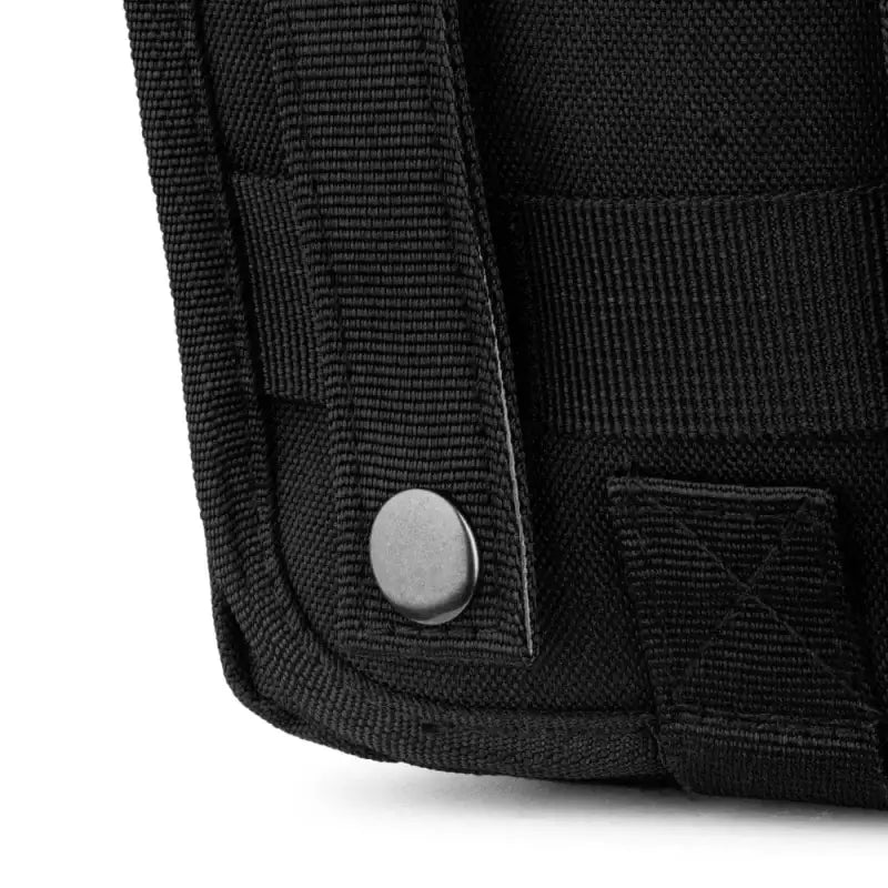 Black fabric corner of Scherber Premium IFAK MOLLE Pouch with metal snap button