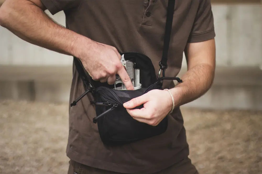 Black Avenger Concealment Gun Pack being opened for easy access and storage