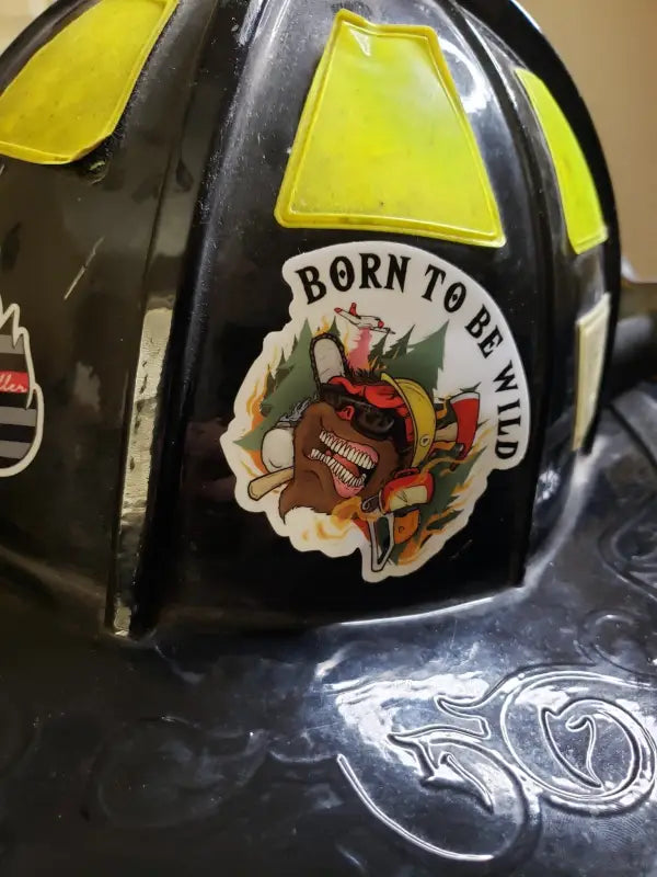 Black firefighter helmet with weather-resistant ink wild helmet decal and yellow reflective panels