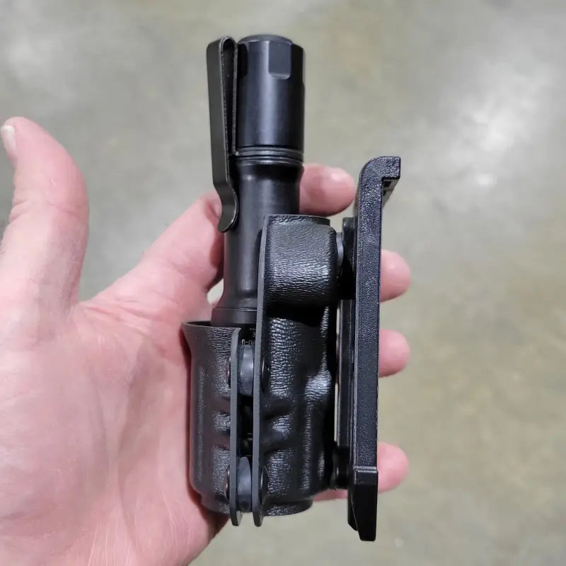 Black MCH Duty Flashlight in a Carrier for Cloud Defensive MCH Duty Flashlight