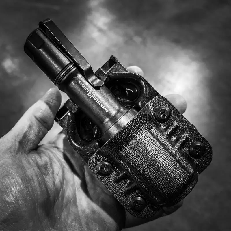 Black MCH Duty Flashlight in a Cloud Defensive MCH Duty Flashlight Carrier holster